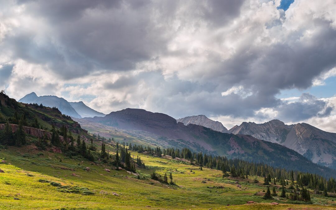 Approaching storm cloud over mountain terrain in Banff National Park.