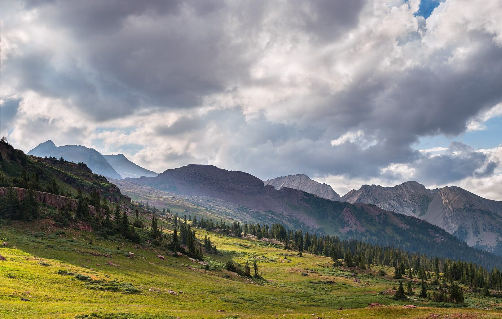 Approaching storm cloud over mountain terrain in Banff National Park.