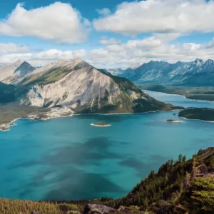 Rawson Lake with emerald water and mountain slopes in Kananaskis