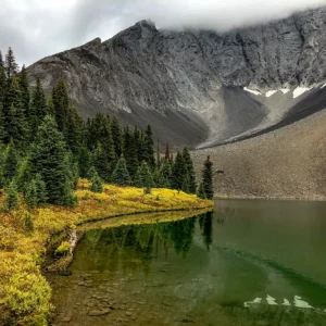 Rummel Lake in Kananaskis with mountain scenery, forested slopes, and a calm alpine setting